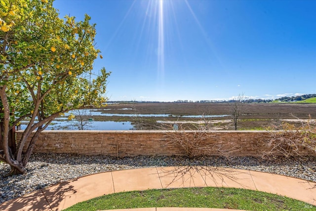 surrounding community featuring a water view