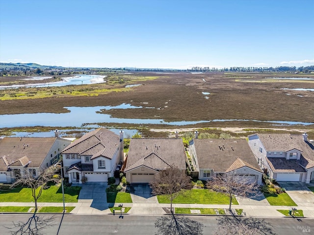 aerial view featuring a residential view and a water view