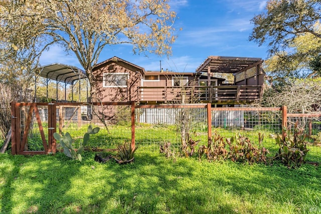 view of yard with a carport, a pergola, and fence