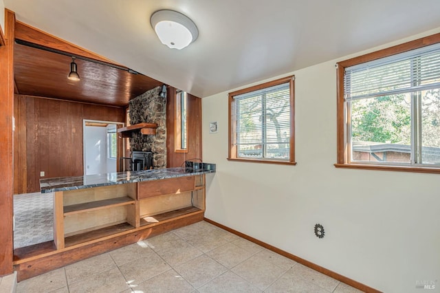 kitchen with wood ceiling, open shelves, baseboards, and tile patterned flooring