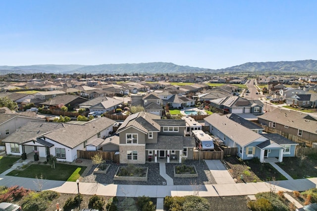 aerial view featuring a mountain view and a residential view