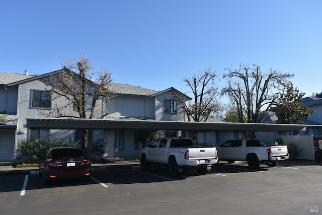 view of front of home with covered and uncovered parking