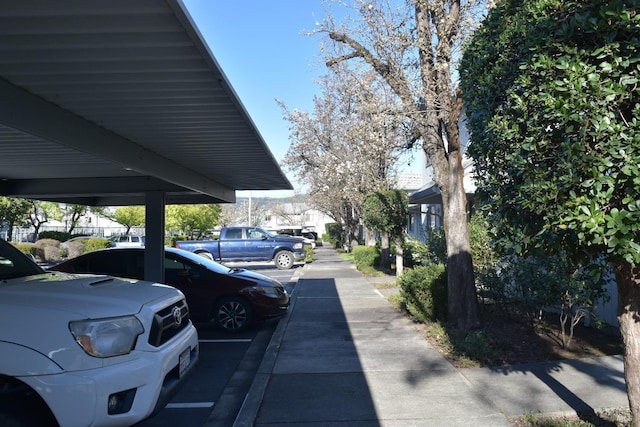 view of partially covered parking lot