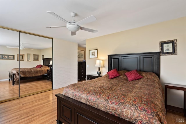 bedroom featuring light wood-style floors and ceiling fan