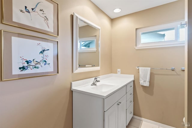 bathroom with vanity, tile patterned floors, recessed lighting, and baseboards