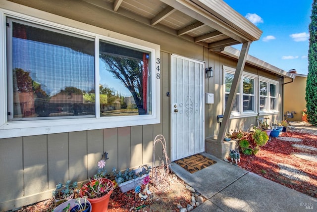 property entrance with board and batten siding