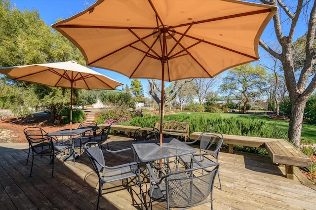 wooden terrace featuring outdoor dining space