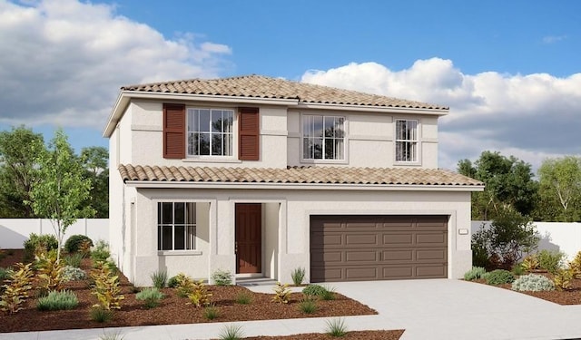 mediterranean / spanish house with driveway, a tile roof, an attached garage, fence, and stucco siding