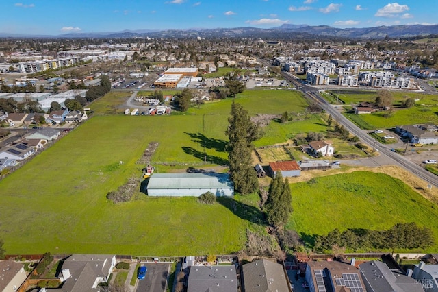 drone / aerial view with a residential view and a mountain view