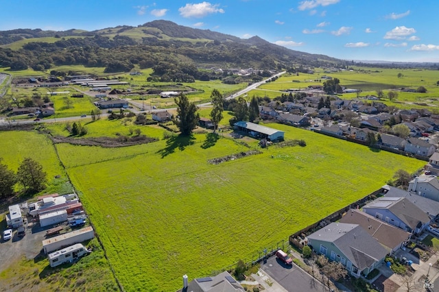 birds eye view of property with a residential view and a mountain view