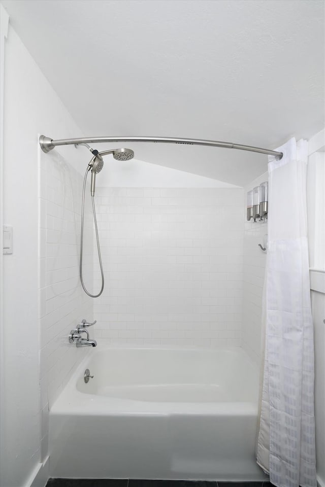 bathroom with shower / bathtub combination with curtain