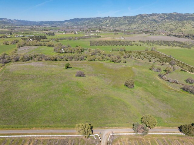 drone / aerial view featuring a rural view and a mountain view