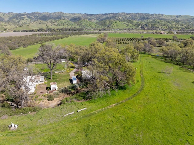 drone / aerial view featuring a mountain view and a rural view