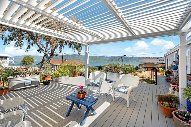 wooden terrace with a mountain view and a pergola