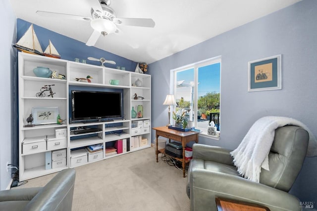 carpeted living room featuring a ceiling fan