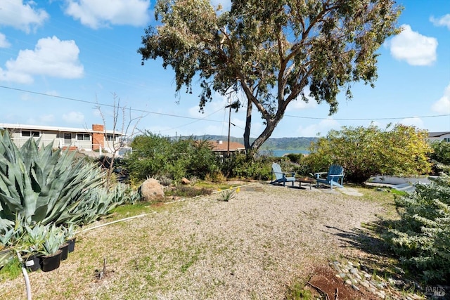 view of yard featuring a fire pit