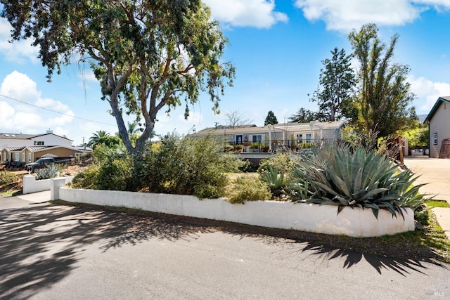 view of front of house featuring fence