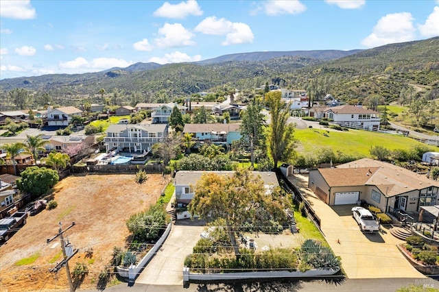 drone / aerial view with a residential view and a mountain view