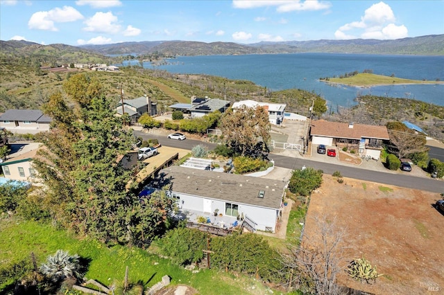 bird's eye view with a water and mountain view