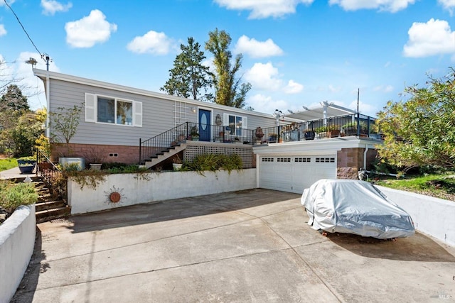 view of front of property with stairs, a garage, and crawl space