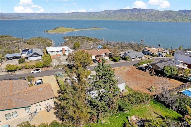 bird's eye view featuring a residential view and a water and mountain view