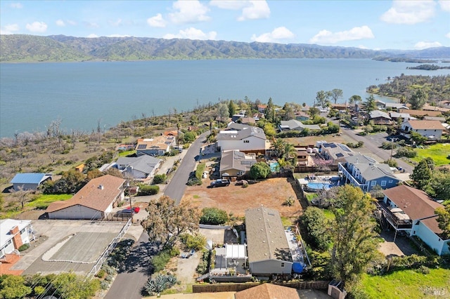 bird's eye view with a residential view and a water and mountain view