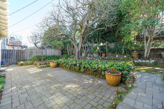 view of patio / terrace featuring fence