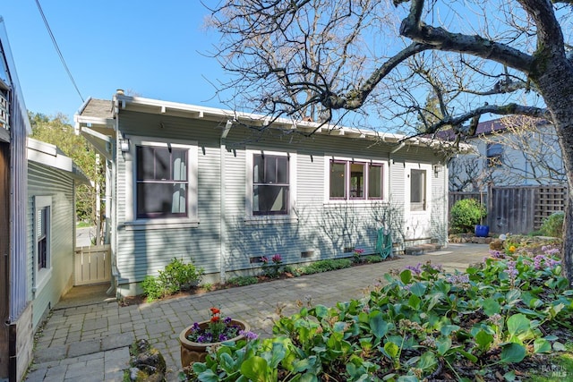 exterior space with a patio area and fence