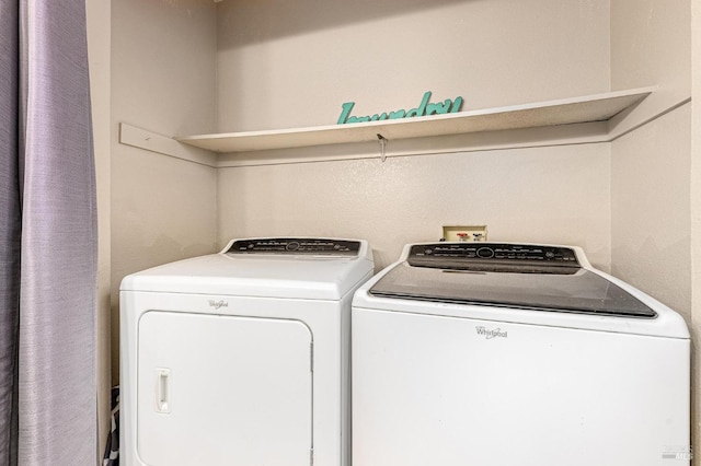 washroom with washer and dryer and laundry area