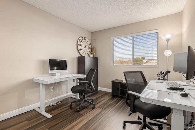 office area with baseboards, wood finished floors, and a textured ceiling