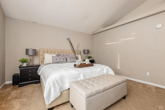 bedroom featuring baseboards, vaulted ceiling, a textured ceiling, and light colored carpet