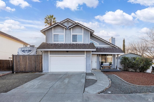 view of front of home with a tile roof, concrete driveway, covered porch, an attached garage, and fence