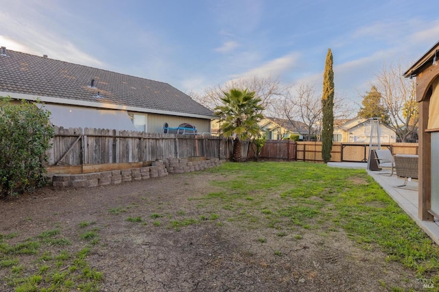 view of yard featuring a fenced backyard and a patio area