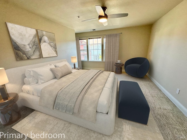 bedroom featuring carpet, baseboards, visible vents, and ceiling fan