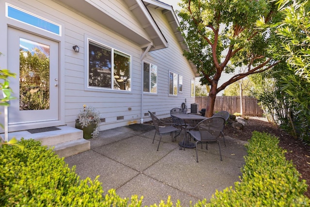 view of patio / terrace with cooling unit and fence