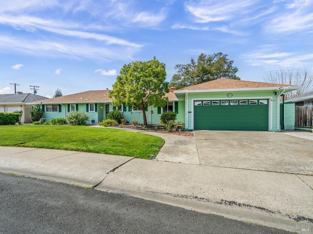 single story home with driveway, an attached garage, and a front lawn