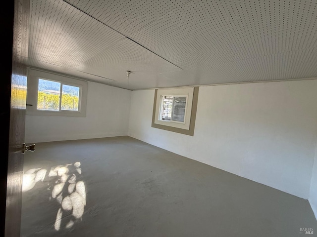 empty room with concrete flooring