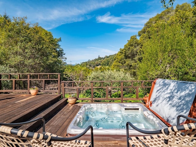 wooden deck with hot tub deck surround