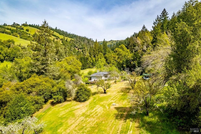 drone / aerial view with a view of trees