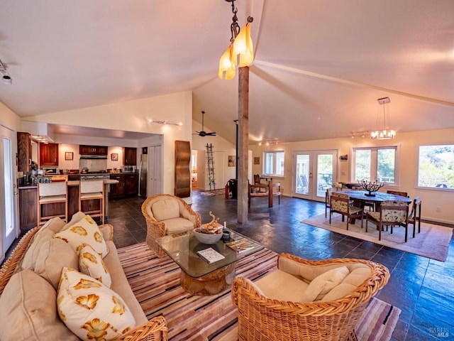 living room featuring french doors, lofted ceiling, baseboards, and a chandelier