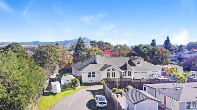 drone / aerial view featuring a mountain view and a residential view