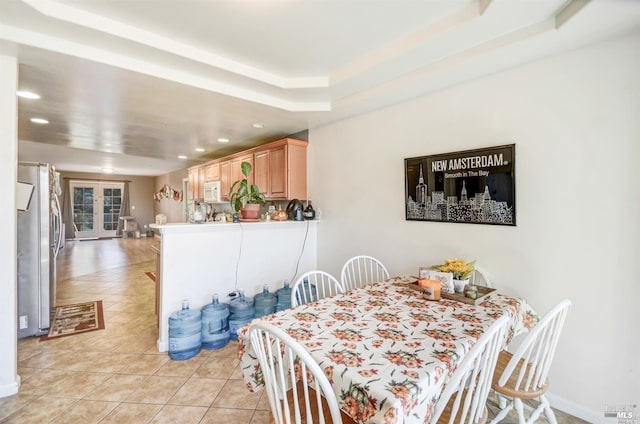 dining room with light tile patterned flooring, recessed lighting, and french doors