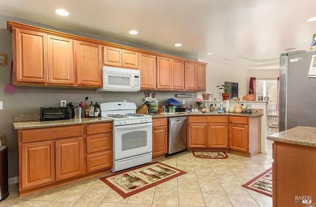 kitchen featuring light tile patterned flooring, recessed lighting, a peninsula, and stainless steel appliances