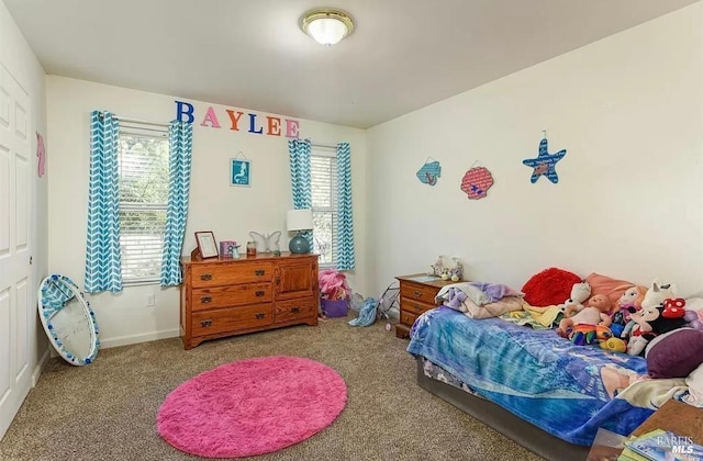 carpeted bedroom with baseboards