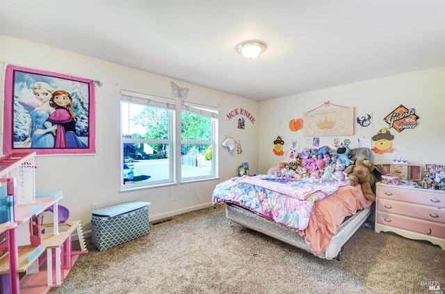 carpeted bedroom featuring visible vents and baseboards
