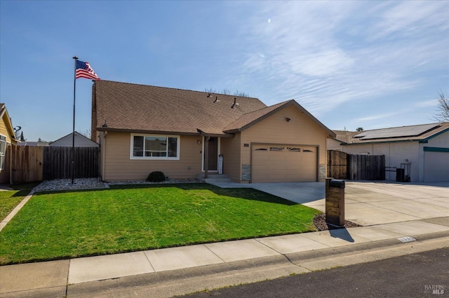 ranch-style house with a front lawn, fence, roof with shingles, concrete driveway, and a garage