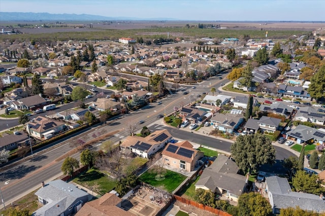 drone / aerial view featuring a mountain view and a residential view