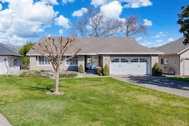 single story home featuring a front yard, an attached garage, driveway, and roof with shingles