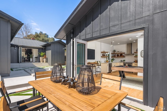 exterior space with outdoor dining space
