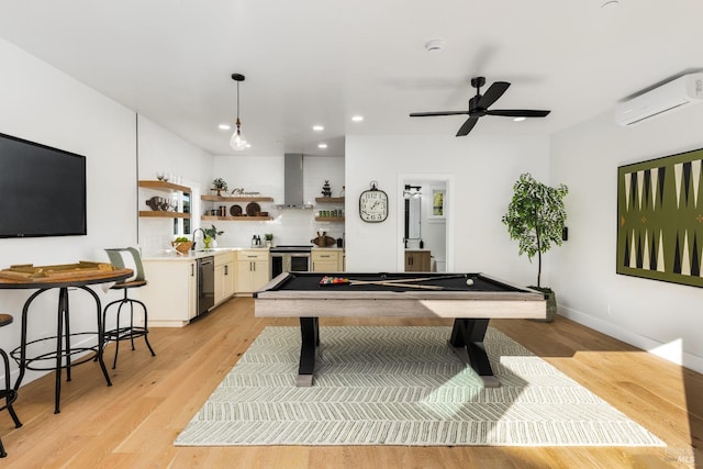 playroom with a wall mounted AC, light wood-type flooring, billiards, recessed lighting, and ceiling fan